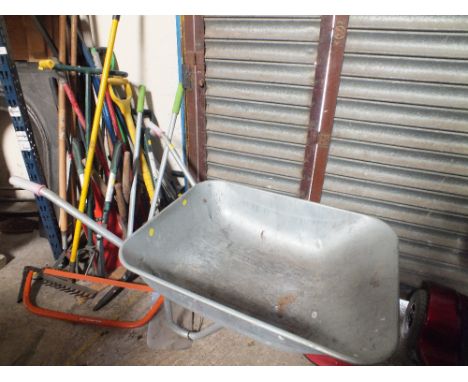 A QUANTITY OF GARDEN TOOLS TOGETHER WITH  A WHEELBARROW