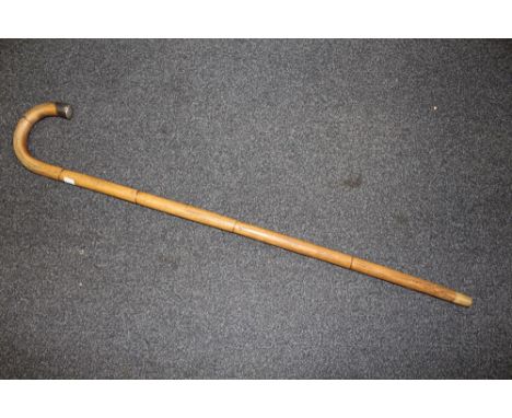 A RUSSIAN WALKING CANE,  with Niello finial and small Russian inset badge to the cane, L 91 cm