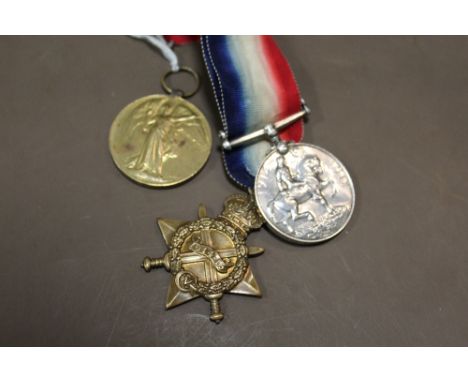 A SET OF THREE FIRST WORLD WAR MEDALS PRESENTED TO 68047 GNR W GORST OF THE RFA