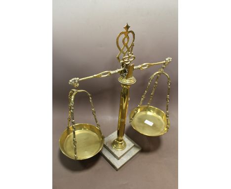 A SET OF BRASS SCALES ON MARBLE BASE