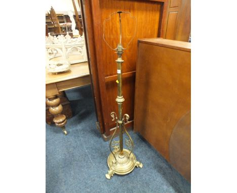 A BRASS EXTENDING LAMP STANDARD - CONVERTED TO ELECTRICITY
