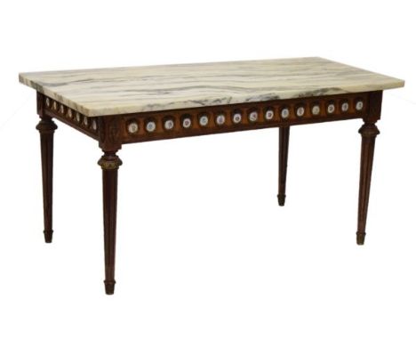 Reproduction French style marble topped rectangular coffee table having ceramic mounts and standing on tapered, turned and fl