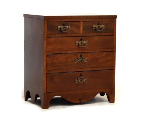 Reproduction Georgian style mahogany table top chest of two short and three long graduated drawers on bracket feet  