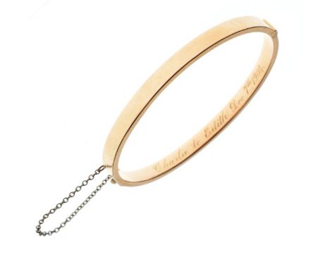 Snap bangle stamped 15ct with presentation inscription to interior dated 1904, 8.9g gross approx  
