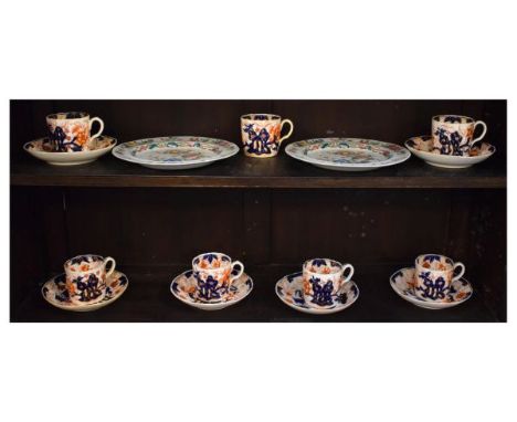 Six 19th Century English porcelain coffee cans and saucers decorated in the Imari pallet, together with a pair of 19th Centur