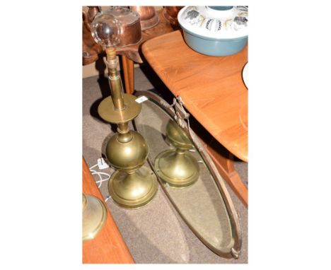 Brass table lamp and a early 20th Century brass framed oval bevelled wall mirror  