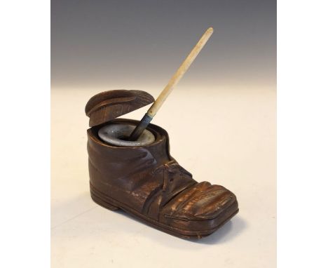 Carved wooden novelty inkwell formed as a boot with ceramic liner and pen  