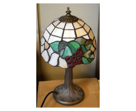 Modern bronze finish table lamp with Tiffany style shade  