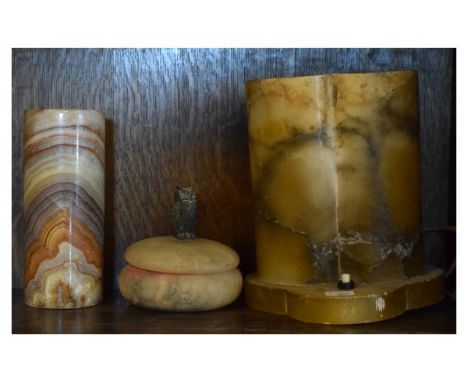 Early 20th Century alabaster lamp, similar powder bowl and cover, the finial formed as an owl and a similar cylindrical vase 