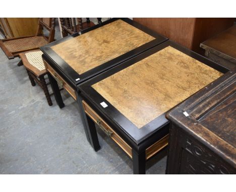 A pair of Chinese influence burr walnut and ebonised lamp tables each with a single drawer. 