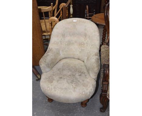 A Victorian button back low seat tub chair. 