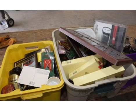 2 Boxes of assorted collectables  to include car badges, Marmite collectors bottles, Guiness advertising items , etc. 