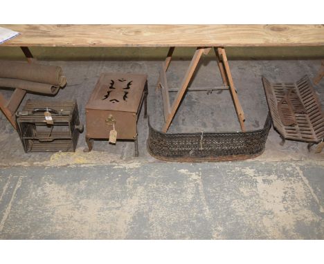 A Folding iron fire escape ladder, an iron fire fender , a footman and an iron fire basket. 