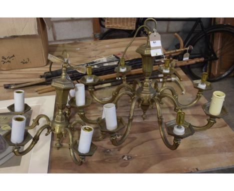 A brass eight branch ceiling light fittingAlong with a conforming five branch example. 