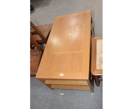 A contemporary light oak coffee table with a pair of drawers. 