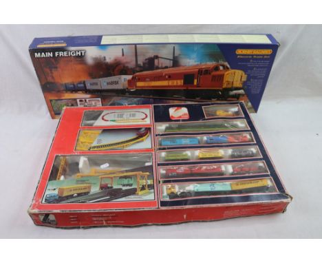 Two boxed OO gauge train sets to include Hornby R1006 Main Freight train set and Lima Container Unloader, both appearing comp