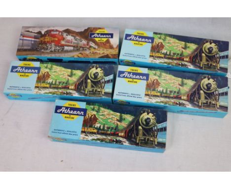 Three boxed Athearn HO scale engines to include 3154 GP9 PWR Union Pacific, 5301 54 FT COV Hoper Santa Fe and 4401 SD40-2 PWR