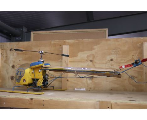 Wood and metal r/c Bell 47G Helicopter in yellow plus a boxed Syma Remiges 94 remote control helicopter