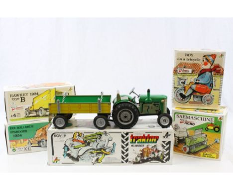 Five boxed Kovap tin plate models to include Hawkey Type B 1924, Moving Moneybox 1924, Tractor and Trailer, Sowing Maching an