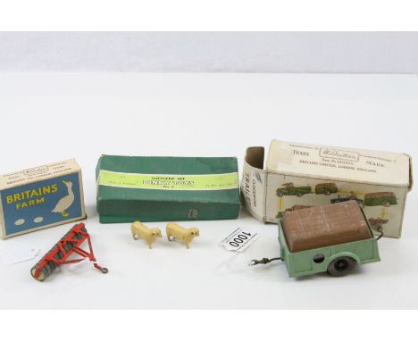 Two boxed Britains Farm accessories to include 2041 Clockwork Trailer and 136F Tractor Roller both with paint loss and tatty 