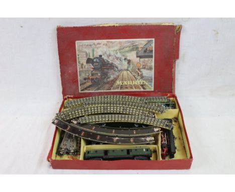 Boxed Marklin HO scale DA846/a electric train sey with DA800 23014 Locomotive in black, three coaches and track, tatty box