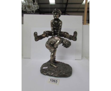 A figure of 2 boys playing leapfrog