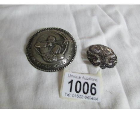 An art deco silver archer brooch and a silver and enamel brooch