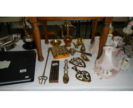 A mixed lot of brassware including cribbage board