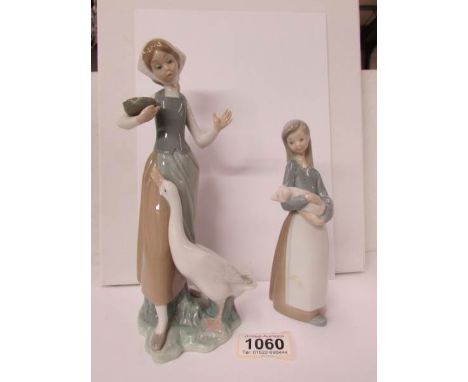 2 Lladro figures being a girl with a goose and a girl with a piglet