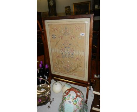 A needlework firescreen