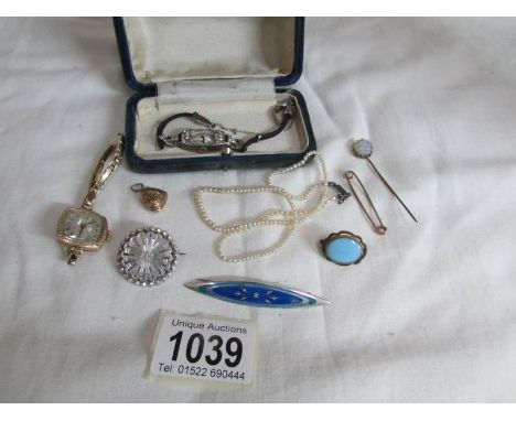 A mixed lot of jewellery including lovers pendant, silver and enamel brooch, ladies wrist watches etc