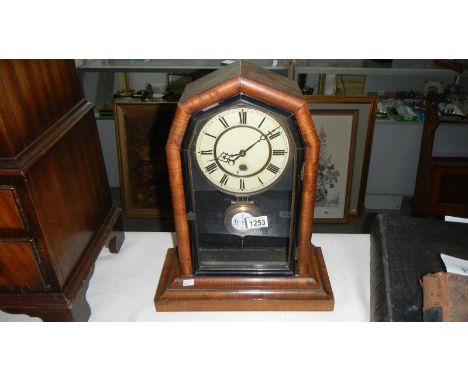 A mahogany mantel clock (enamel dial a/f)