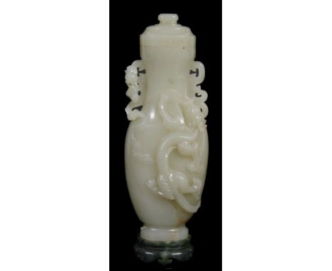 A celadon jade two handled vase and cover, of slender form   A celadon jade two handled vase and cover,   of slender form, ca
