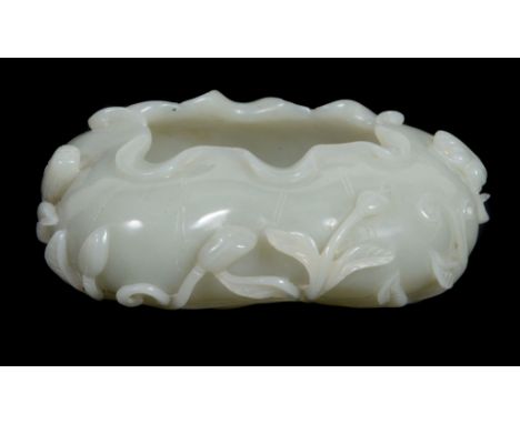 A Chinese celadon jade brush washer, of even colour with one area with... A Chinese celadon jade brush washer, of even colour