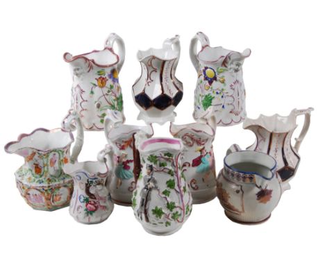A selection of mostly British pottery relief-moulded jugs , various dates   A selection of mostly British pottery relief-moul
