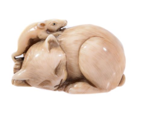 An Unusual Ivory Netsuke of a Cat, the feline lies coiled up asleep and...   An Unusual Ivory Netsuke of a Cat,   the feline 