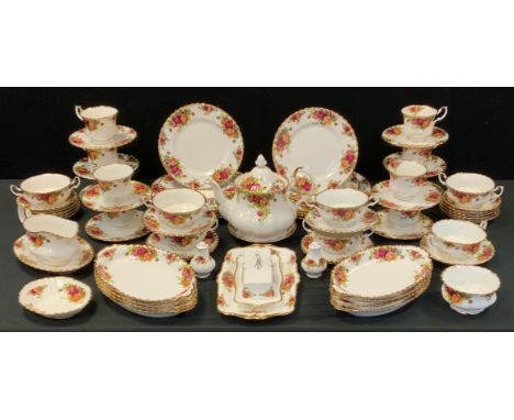 A Royal Albert Old Country Roses dinner and tea service for nine, comprising tea pot, cups and saucers, tea plates, soup, bow