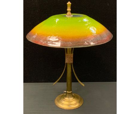 An Arts and Crafts brass table lamp with Studio Art glass shade 