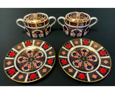 A pair of Royal Crown Derby 1128 pattern sucriers and covers, printed mark (first);  two similar side plates (4) 