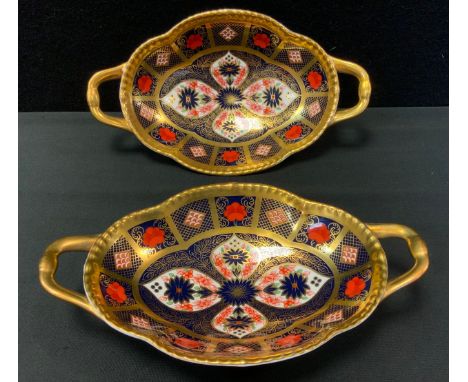 A Royal Crown Derby 1128 pattern two handled shaped oval dishes, 22cm wide, printed mark (first) 