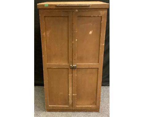 A 20th century pine W.J Harris &amp; Co Ltd. Peckham London Se collector cupboard, square top above a pair of cupboard doors 