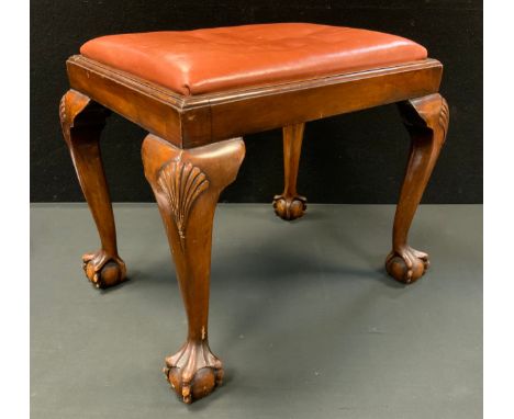 A 20th century mahogany stool, shells to kness, ball and claw feet 