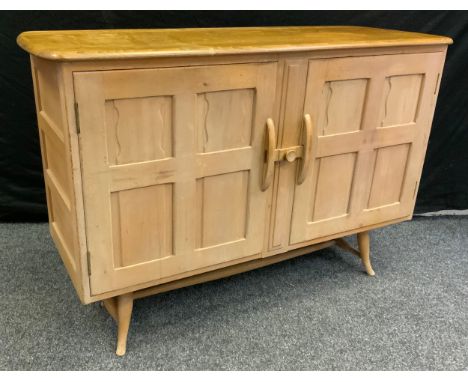 An Ercol blonde finish elm and beech sideboard, 83cm tall x 123.5cm x 45.5cm, c.1970. 