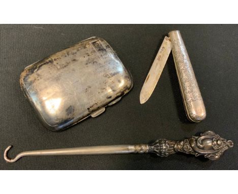 A silver cigarette case;  a silver button hook;  a silver pen knife 