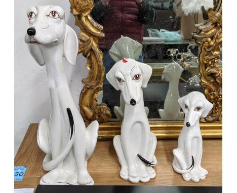 CERAMIC DALMATION DOGS, a set of three, Italian, of graduated form, largest 58cm H, underglaze painted ceramic. 