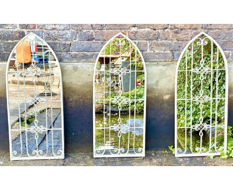 ARCHITECTURAL GARDEN MIRRORS, a pair, 69cm x 45cm. 