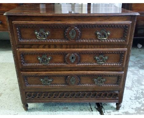 PETITE COMMODE, 74.5cm W x 66cm H x 46cm D, early 20th century French Louis XVI manner oak with three drawers above a secret 