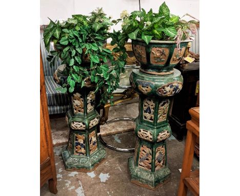 JARDINIERES ON STANDS, Two similar ceramic, each 100cm H, the octagonal planters on decorative glazed bases, artificial plant