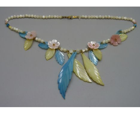 A vintage mother of pearl necklace 