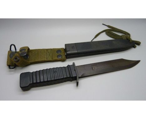 A US Commando knife in scabbard 